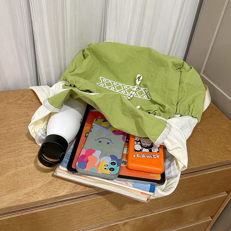 The new forest-themed ins badminton backpack with a high aesthetic level, fresh and sweet, drawstring opening, and a color-blocking lightweight backpack Application Scenario