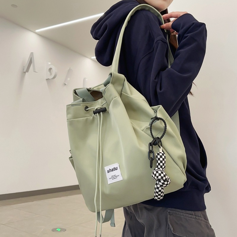 Small backpack 2024 new travel drawstring niche schoolbag for women, versatile and versatile, large-capacity handbag full figure