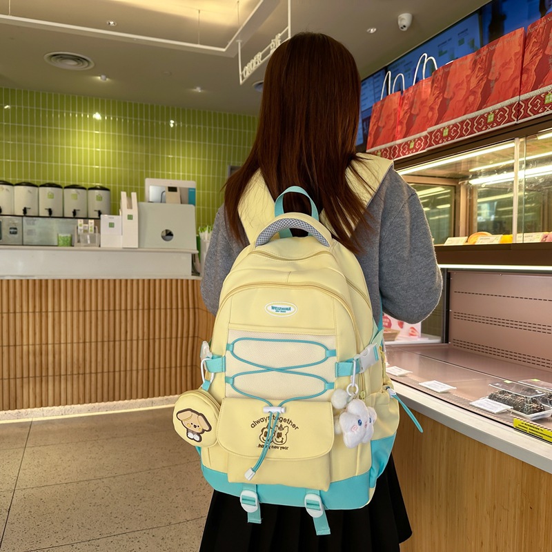 The new 2025 Korean version of the ins high-quality backpacks for primary and secondary school students in grades three to six with contrasting colors and simple design details Picture