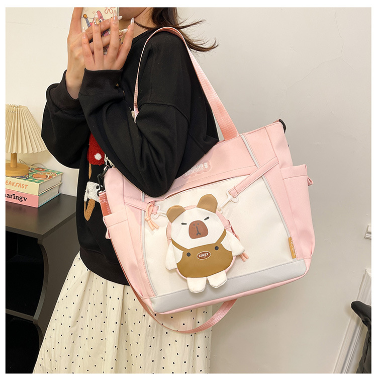 2025 New school-style cartoon single-shoulder tutorial bag, large-capacity casual handbag, cute commuter crossbody bag details Picture