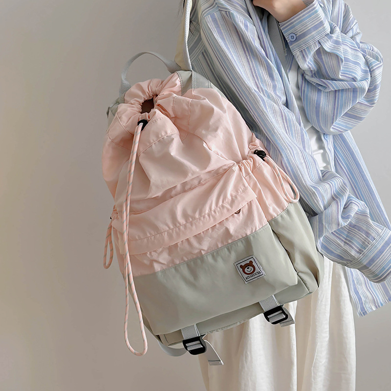 The new backpack 2024 is a lightweight and casual backpack with a mountain style and a high level of appearance. It is a color-blocking, drawstring, and outdoor sports backpack details Picture