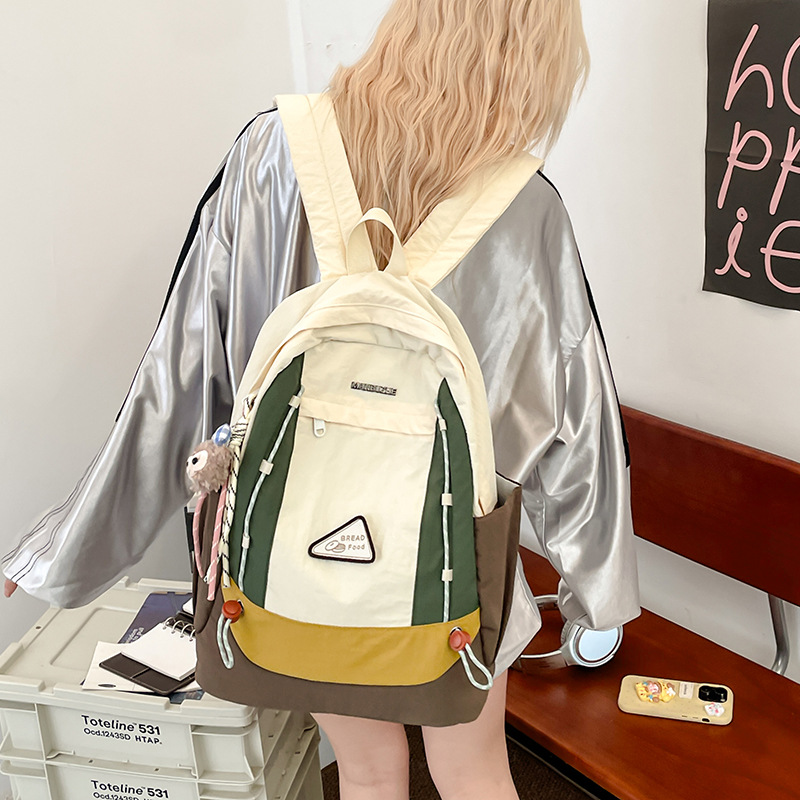 New minimalist Korean-style color-blocking schoolbag, lightweight travel and casual backpack, high appearance level, dirt-resistant and large-capacity single-shoulder bag full figure