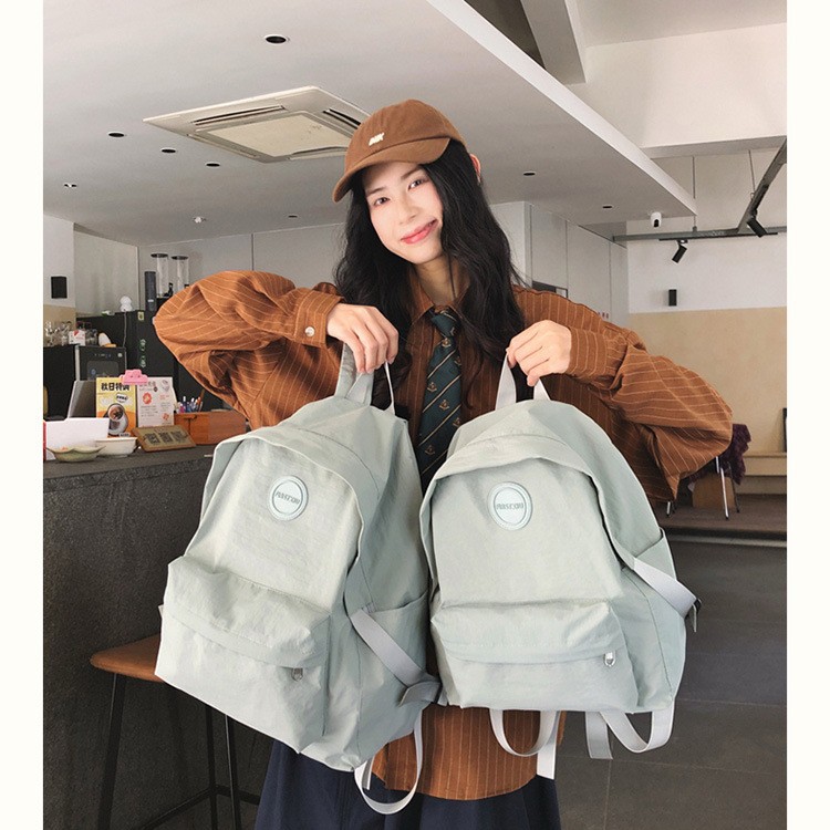2025 New Japanese ins simple and versatile solid color backpack, lightweight and trendy backpack, casual schoolbag for grades 1-6 details Picture