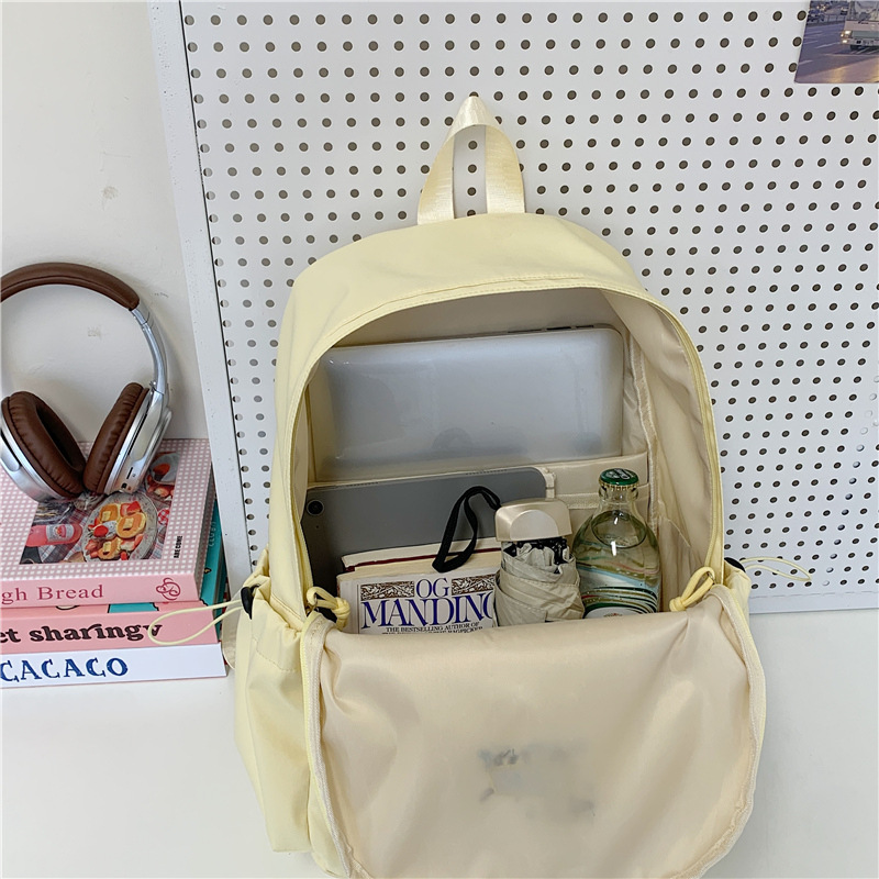 A new Japanese-style ins fresh and sweet candy-colored backpack for junior and senior high school students with a large capacity for light travel Application Scenario
