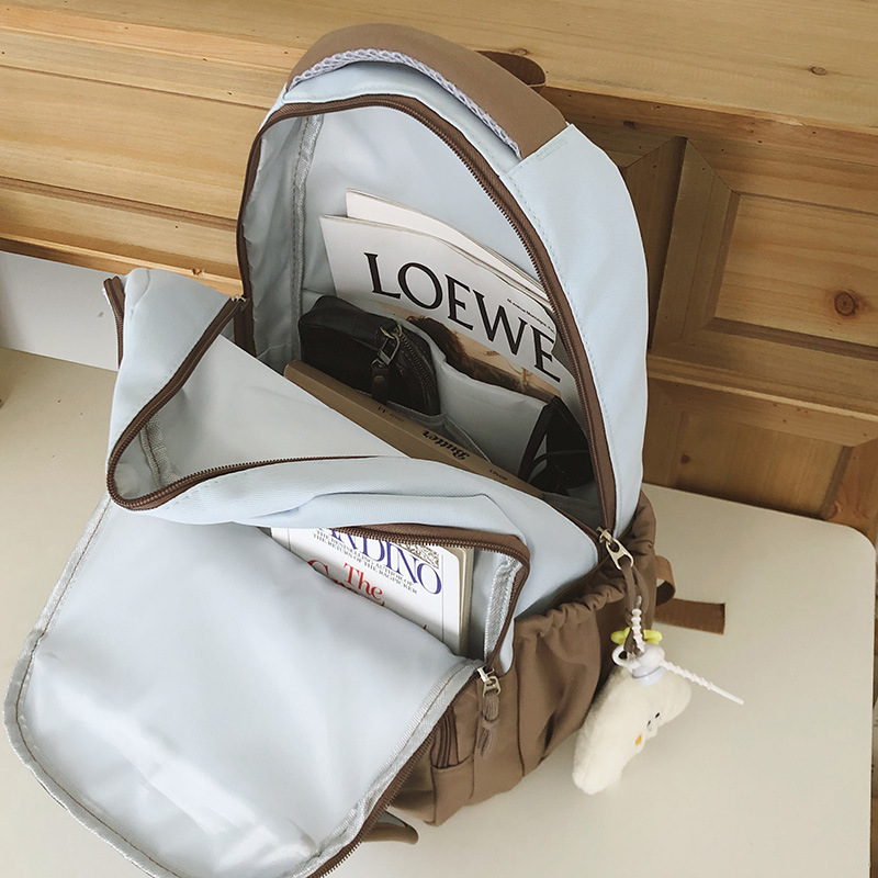 A new high-appearance-level Korean ins fresh and sweet color-blocking backpack, a lightweight and large-capacity backpack for junior and senior high school students Application Scenario