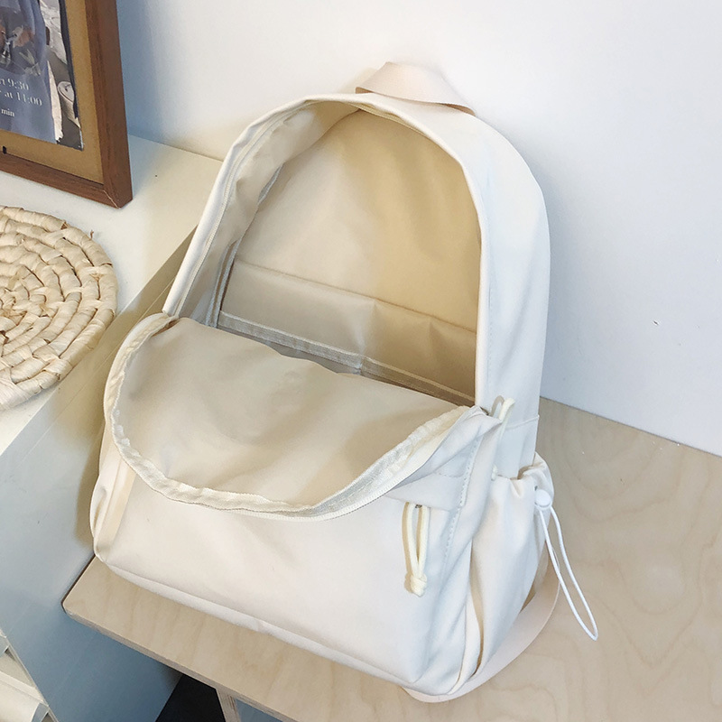Korean InS-style versatile schoolbag for middle and high school students, solid color letter backpack, high appearance level, simple and lightweight backpack Application Scenario