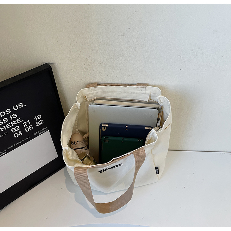 Solid-color lettered, artistic and laid-back style single-shoulder bag, simple commuting and school canvas bag, casual and versatile new tote bag Specification drawing