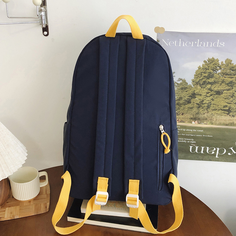 A new Korean-style ins high-appearment-level solid color simple letter backpack for couples, a casual, lightweight and large-capacity backpack Specification drawing