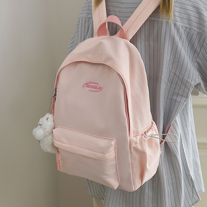 The 2025 new solid-color Ins-style backpack in Korean style is versatile and has a high level of appearance. It is a simple and large-capacity student schoolbag details Picture
