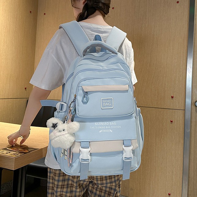 The new schoolbag for girls' high school students features a striking color contrast. It is a high-quality multi-layered backpack for primary and secondary school students details Picture