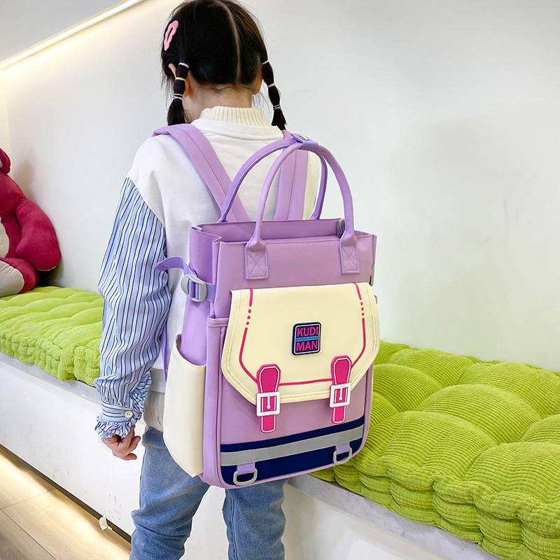 The 2025 new children's after-school handbag is versatile and has a large capacity. It is a school backpack that reduces the burden and features an art bag printed with a logo full figure
