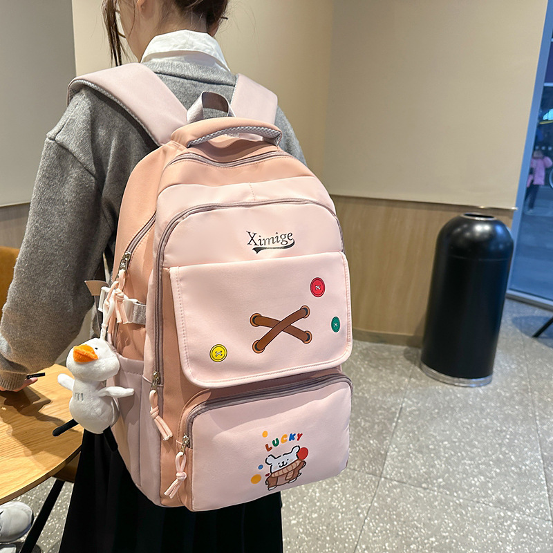 This is a cute and adorable cartoon backpack for girls in the Korean version of the ins academy style, designed for students in grades 3 to 6 full figure