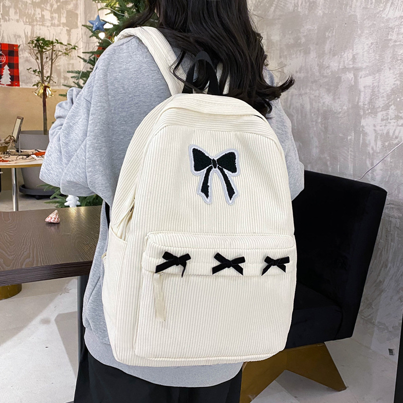 2024 New schoolbag for junior high school girls, high appearance level bow backpack, down and laid-back style college student backpack for girls full figure