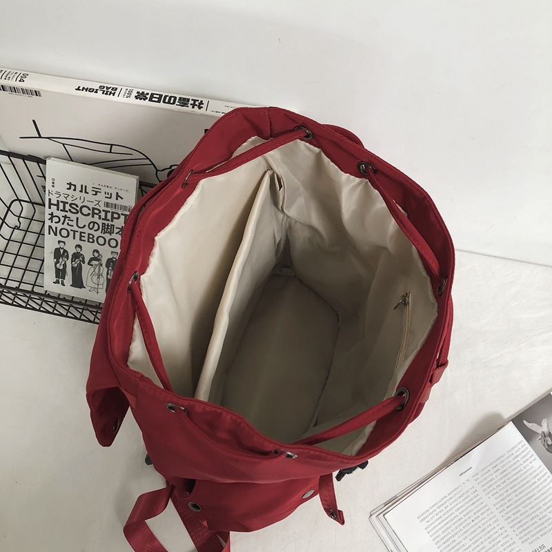 New simple and versatile schoolbag for men, Korean style ins academy junior high school student backpack, high appearance level, trendy brand couple backpack Application Scenario