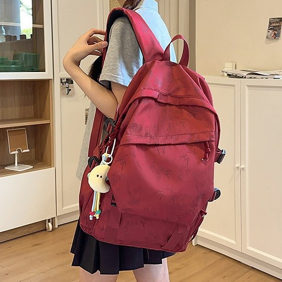 A new high-appeal Korean-style ins solid color simple leaf print backpack for couples, a lightweight and large-capacity backpack details Picture