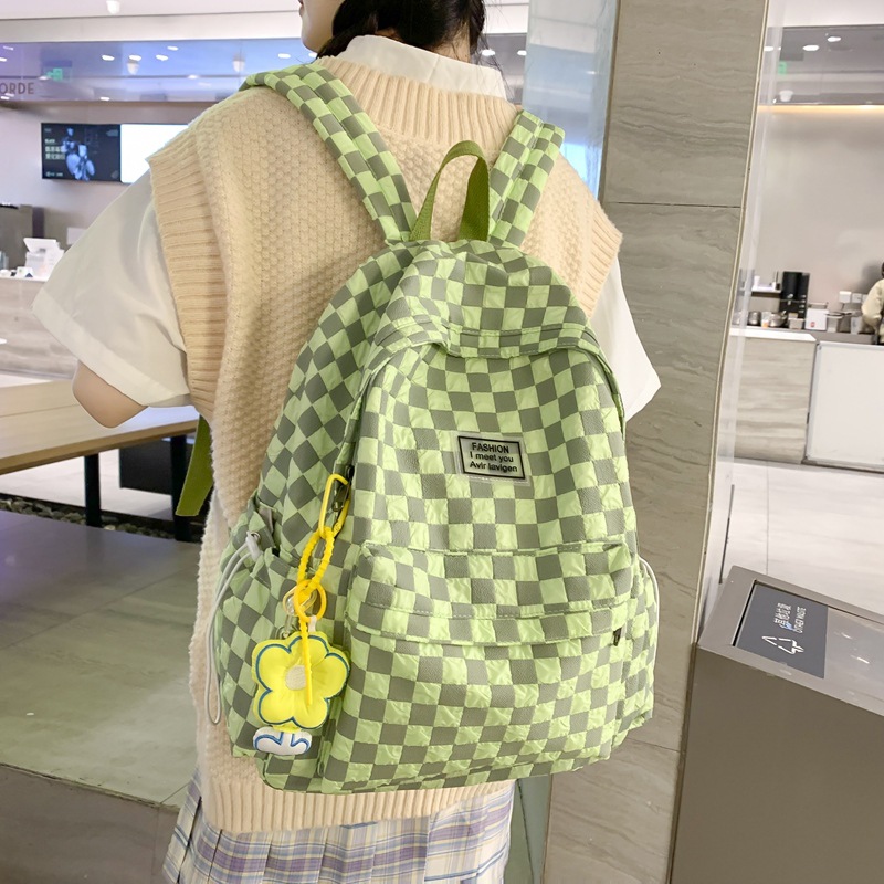 The 2025 new trendy schoolbag for girls in grades 1-6 features a large-capacity checkerboard pattern backpack and a fashionable color-blocking couple backpack details Picture