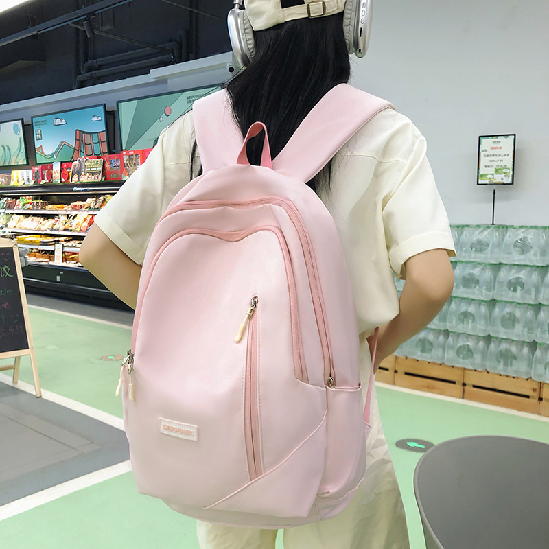 A new solid-color Korean-style casual backpack for junior high school students in an ins style full figure