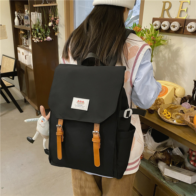 A new minimalist backpack with a Korean niche design, a versatile travel backpack, and a lightweight, color-blocking, large-capacity student schoolbag details Picture