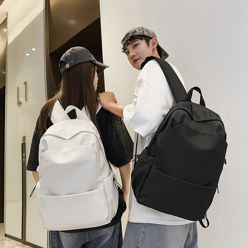 A new Korean-style ins high-appearation-level solid color simple backpack for couples, a lightweight travel and mountain climbing backpack with large capacity full figure