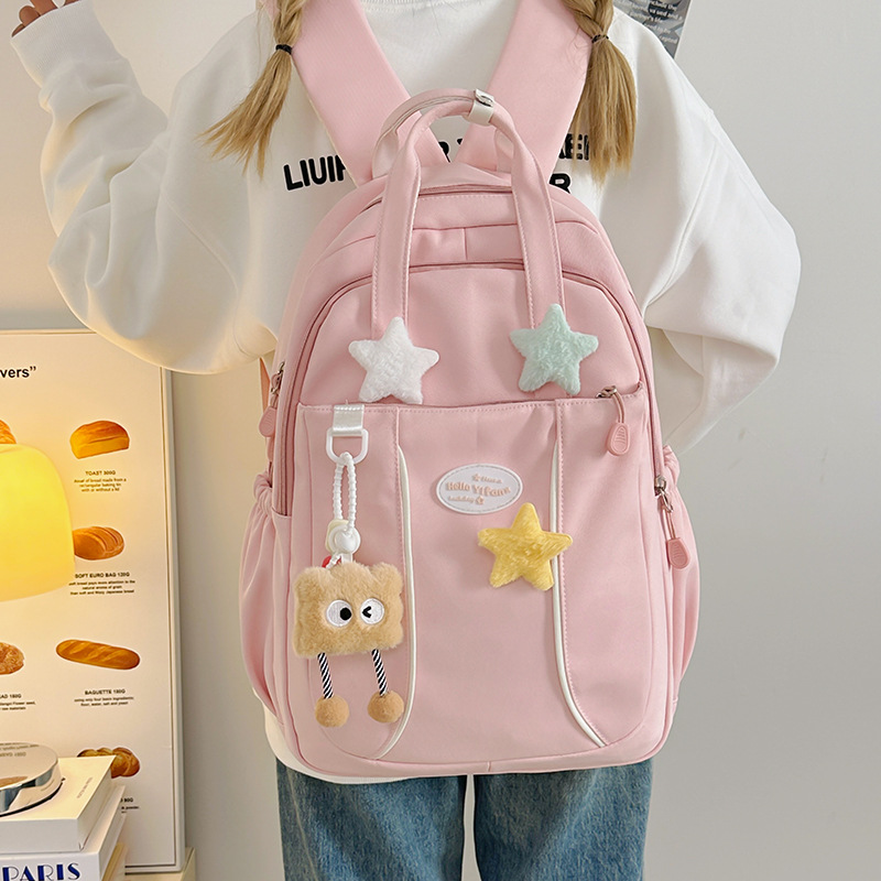 Korean candy-colored, simple and large-capacity schoolbag for grades 3-6, waterproof, lightweight and versatile backpack, casual travel bag full figure