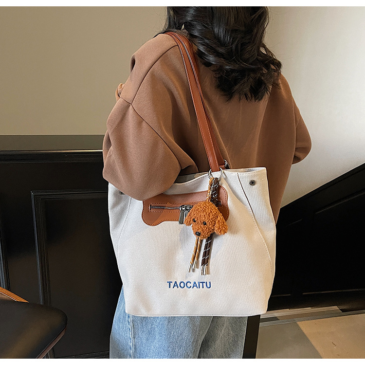 2025 New stylish and versatile canvas tote bag, large-capacity school commuting backpack, casual and simple backpack full figure