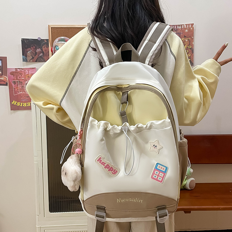 The new summer backpack for women is fresh and cute with a college style. It has a large capacity and is a schoolbag for junior high school, senior high school and college students details Picture