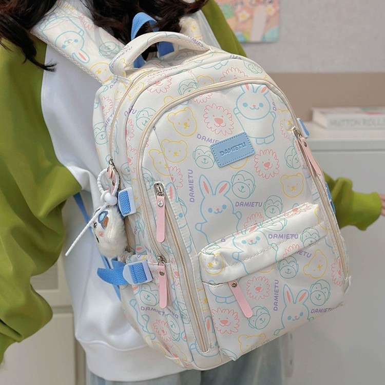 A new style of simple and cute graffiti schoolbag for boys and girls, a trendy large-capacity student backpack for junior high school and senior high school details Picture