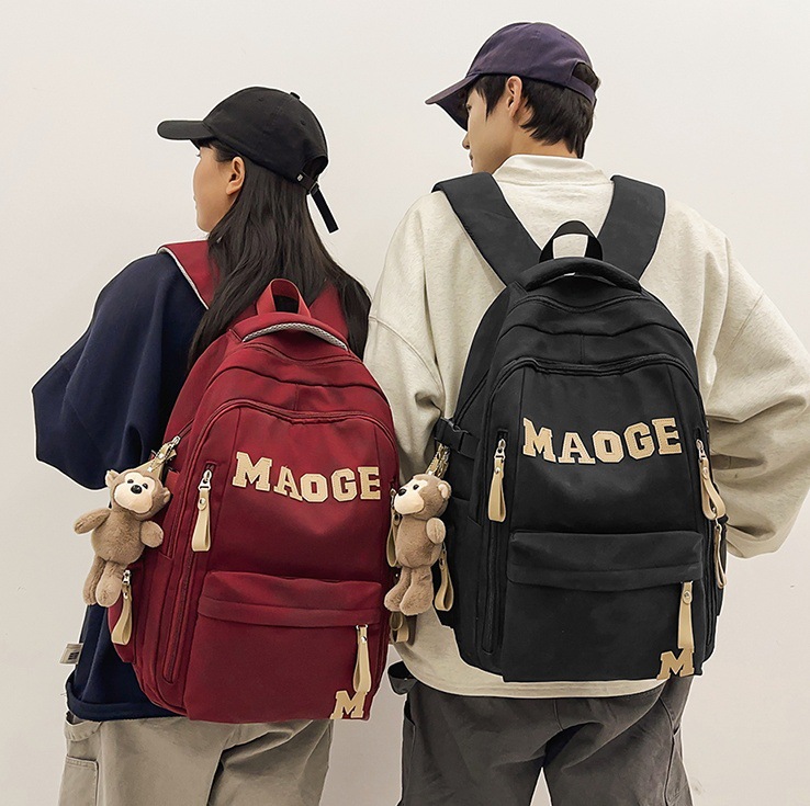 2025 New high-appearance-level middle school backpack with large capacity, Korean version of ins college style couple casual travel backpack full figure