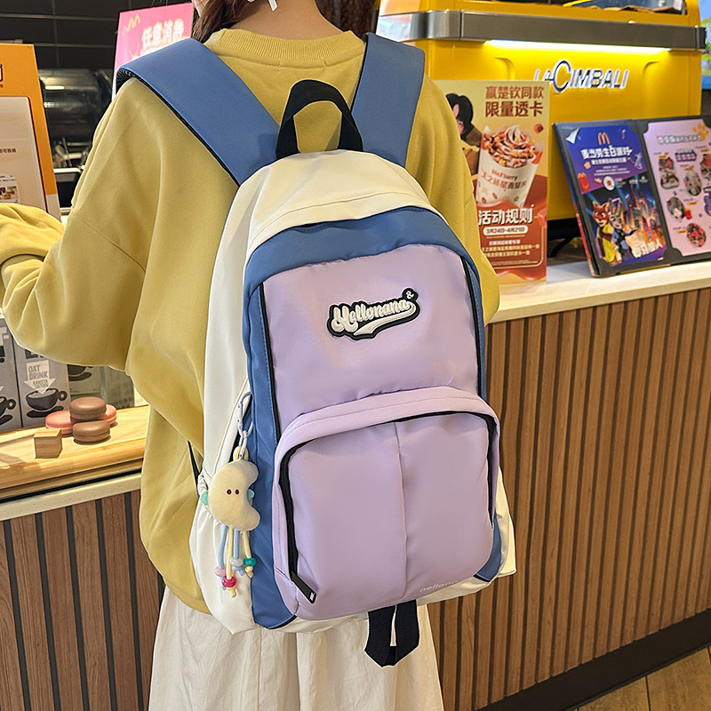 The 2025 new model of junior and senior high school students features a niche design with a high level of appearance. It is simple and versatile, with a contrasting color American retro backpack full figure