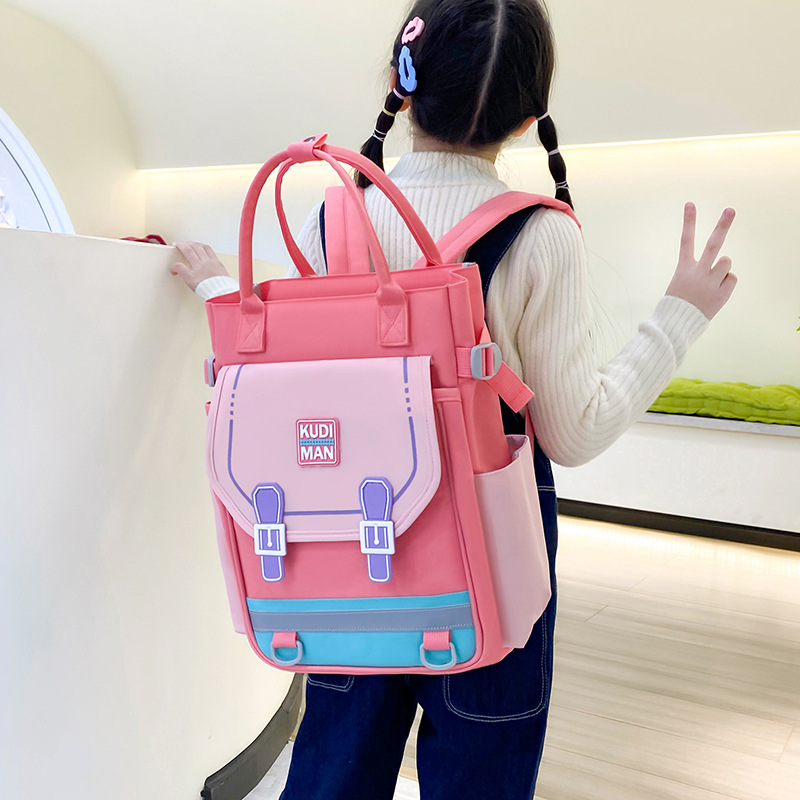 The 2025 new children's after-school handbag is versatile and has a large capacity. It is a school backpack that reduces the burden and features an art bag printed with a logo details Picture