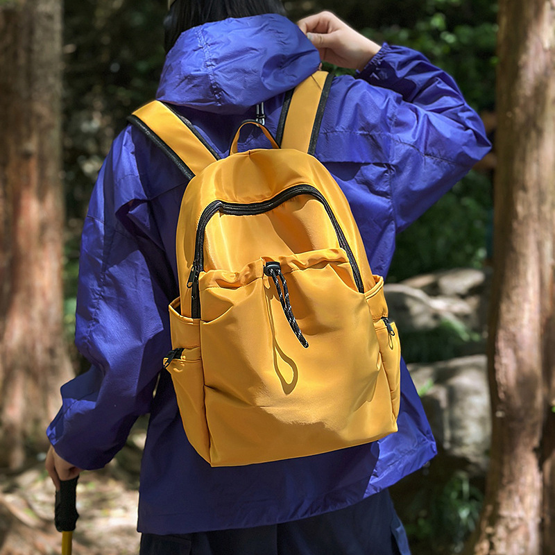 A new multi-purpose travel backpack for both men and women with a high aesthetic level. A Korean version of Instagram multi-pocket drawstring backpack with large capacity full figure