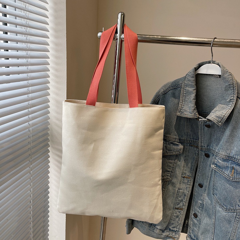 2025 New canvas handbag, casual cartoon, business commuting single-shoulder bag, travel tote bag, simple mommy bag Application Scenario