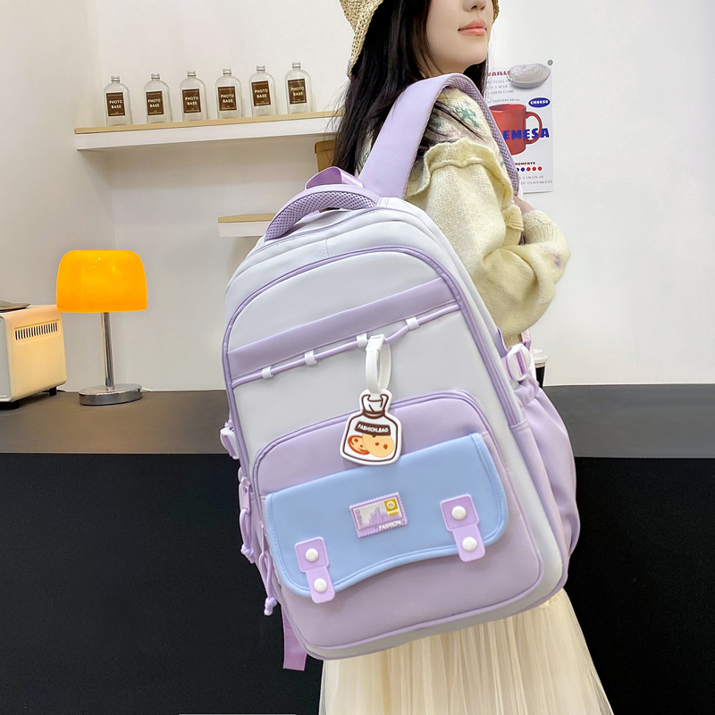 The new schoolbag has a high appearance level. It is a multi-layered backpack for middle school students and a cute Korean-style backpack for primary school students from grades three to six details Picture