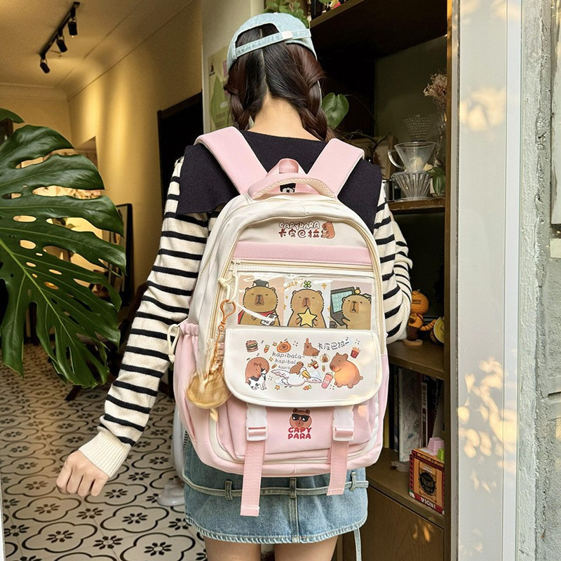 The manufacturer's casual backpacks for boys, girls, primary school students, grade 6 and junior high school students are all cute cartoon new popular backpacks and backpacks full figure