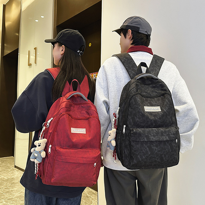 New large-capacity, trendy and versatile schoolbag for junior and senior high school students, couple fashion embossed simple, casual and lightweight backpack details Picture