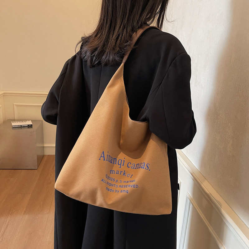 Korean-style artistic and laid-back letter single-shoulder canvas underarm bag 2025 new casual, fashionable and versatile student tote bag details Picture