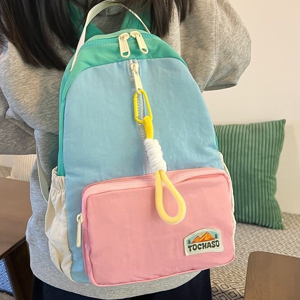 Japanese-style Instagram cute and lightweight children's travel backpack with high appearance level, ice cream color matching soft girl travel backpack full figure