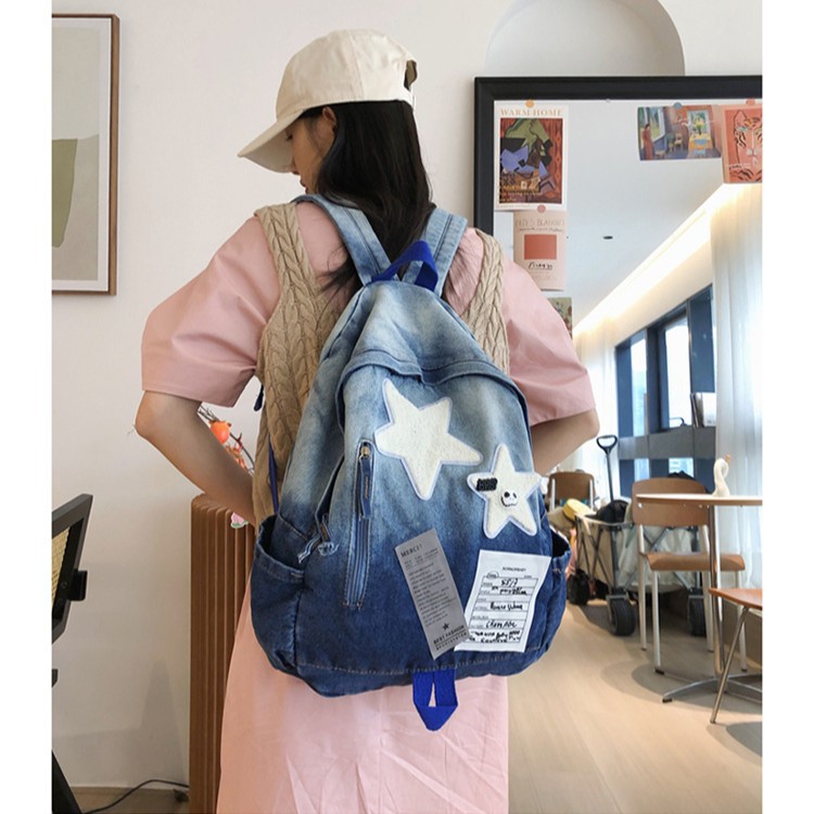 A versatile student backpack with a large capacity, simple and trendy design, a new gradient washable denim backpack for casual use Application Scenario