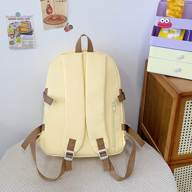 2025 New Japanese-style cute Korean-style versatile middle and high school schoolbag, casual and simple solid color bow backpack Application Scenario