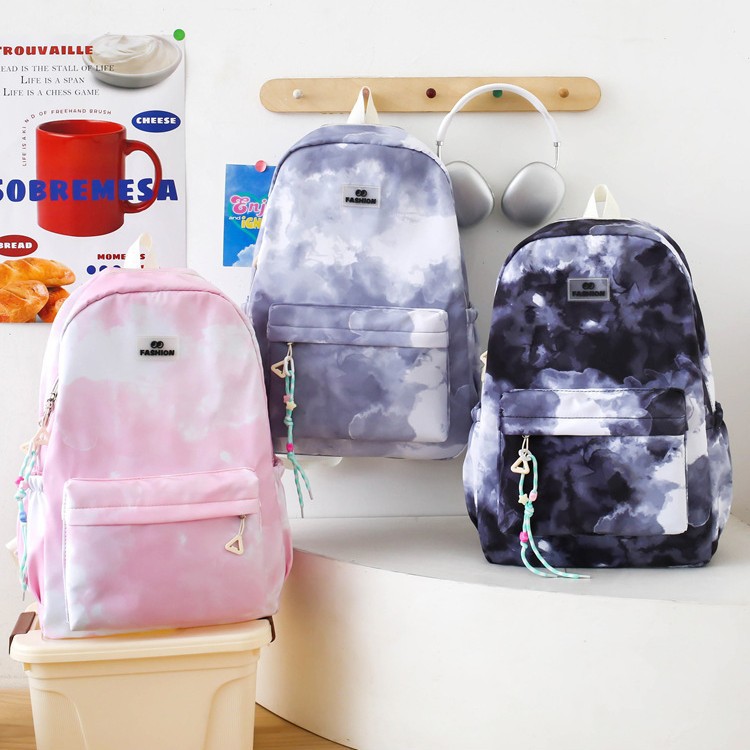 2025 New style nylon schoolbag for primary school students, large-capacity simple backpack for girls, multi-functional tie-dyed school bag Application Scenario