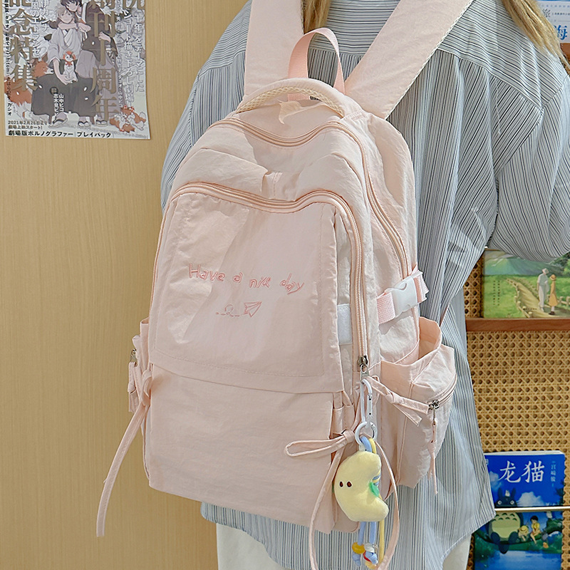 Japanese-style lightweight solid-color backpack, large-capacity outdoor travel backpack, casual and versatile college student commuting schoolbag full figure