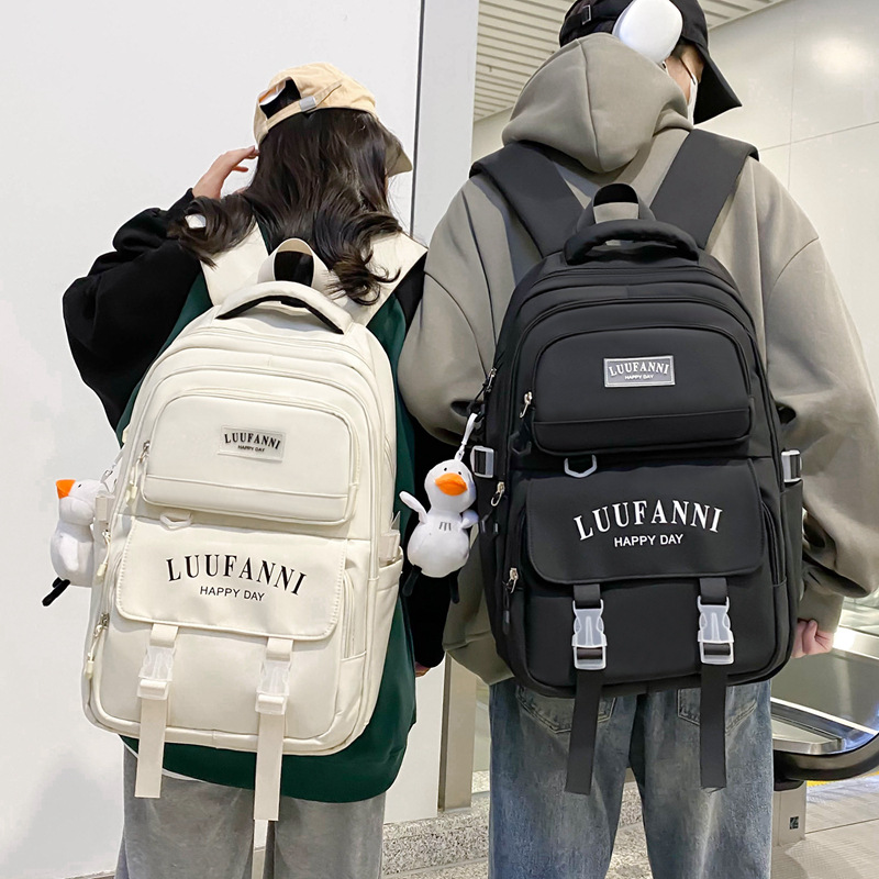 A new Korean style Instagram trendy couple's casual travel backpack with multiple compartments for primary and secondary school students full figure
