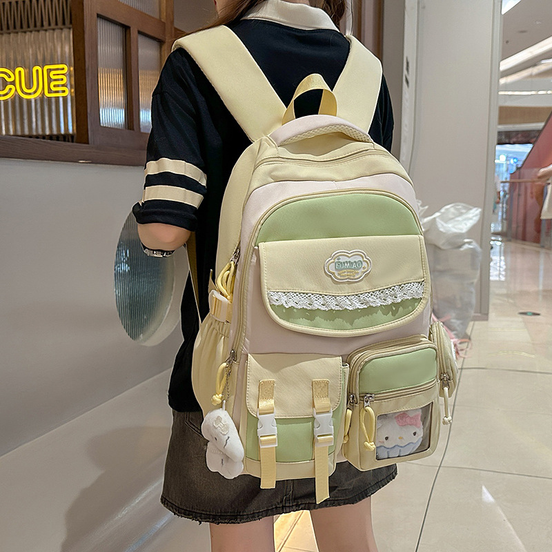 A new Japanese-style college style backpack with a high appearance level, fresh and sweet color contrast and splicing, and a large-capacity backpack for junior and senior high school students full figure