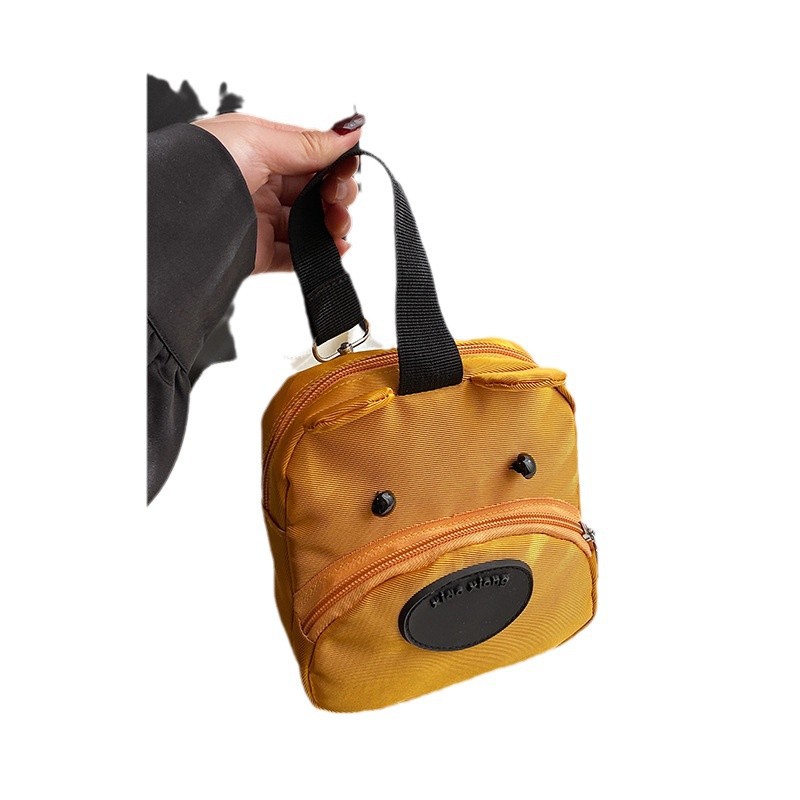 Wholesale of cute puppy mobile phone bags, best-selling hand-held storage small bags, packaging for loose change and cosmetics, women's hand-held canvas bags Item Picture