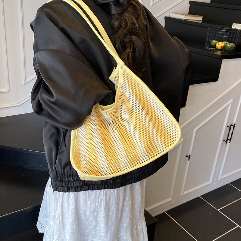 New Summer 2025 striped, versatile underarm bag, women's hollowed-out mother and child, large-capacity bucket bag, versatile shoulder bag details Picture