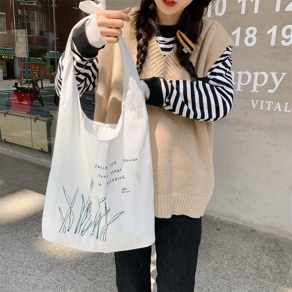 22274 Fresh printed small green leaf lace-up vest bag, large-capacity canvas bag, student schoolbag for class, casual bag Item Picture