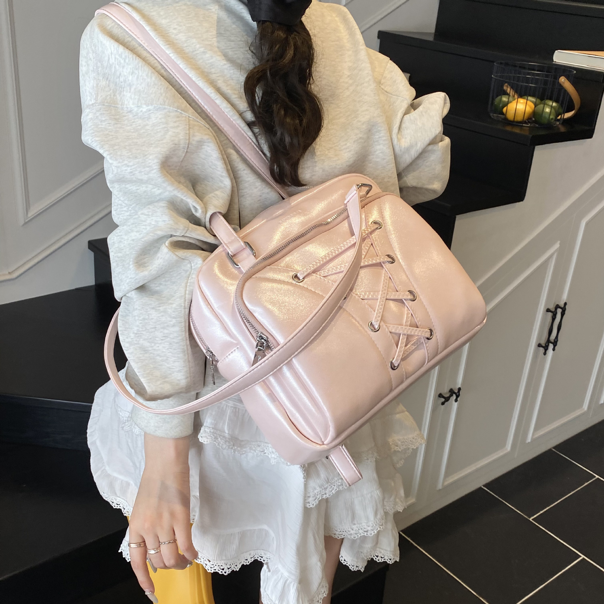 A fashionable hand-held Boston backpack for women in spring 2025, featuring a trendy, casual, versatile large capacity and a high-end feel Application Scenario