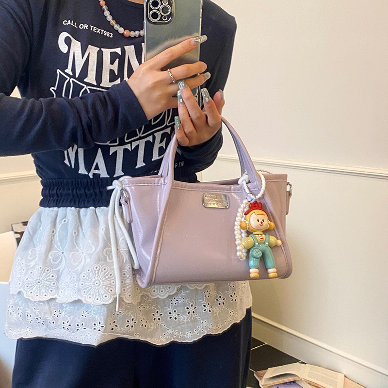 Korean high-end and fashionable hand-held bucket bag for women 2025 new style, fashionable and versatile, niche design, single-shoulder crossbody bag details Picture