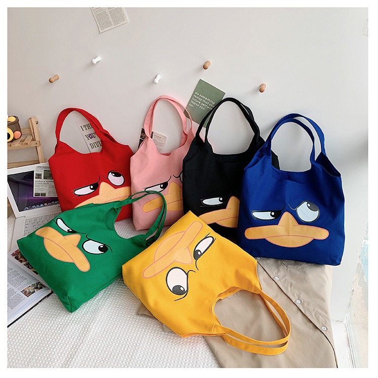 Wholesale canvas bags for girls, 2024 new style Japanese cartoon, cute and funny, large-billed duck single-shoulder bag, student handbag full figure