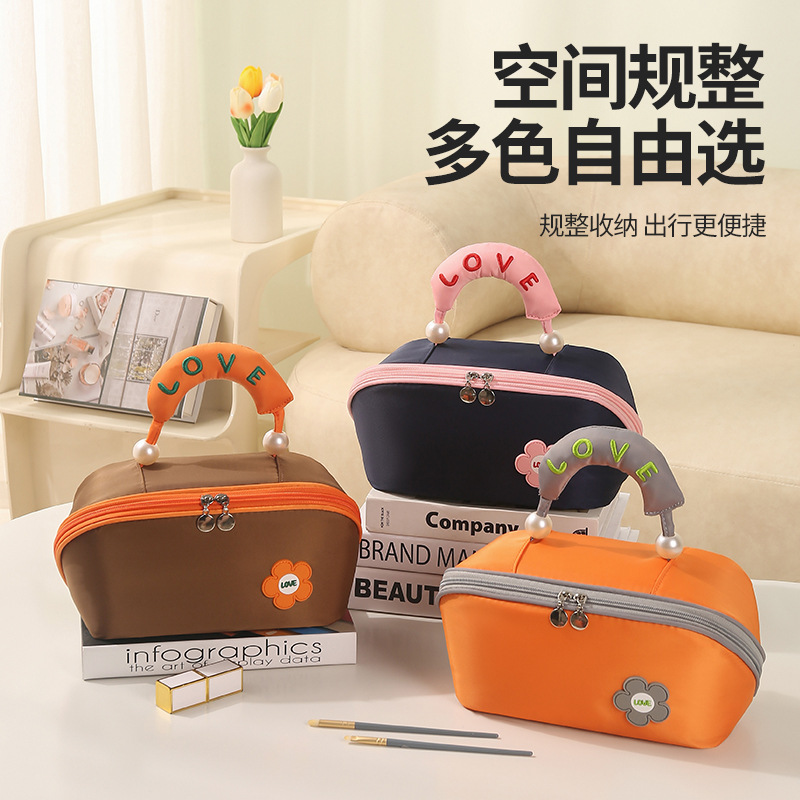 Runhui's new pearl pillow makeup bag, large-capacity hand-held makeup bag, high appearance level travel toiletries bag, portable full figure